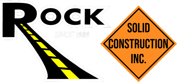 Logo with "Rock" and a road graphic, plus an orange diamond sign reading "Solid Construction Inc.